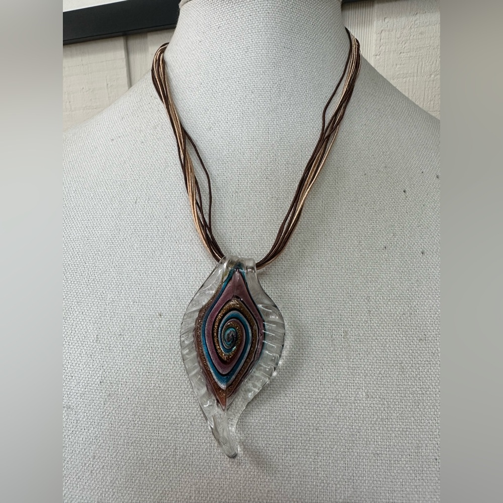 Large glass feather swirl pendant on corded necklace